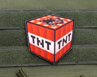 Parche de velcro para videojuegos TNT con mensaje de moral