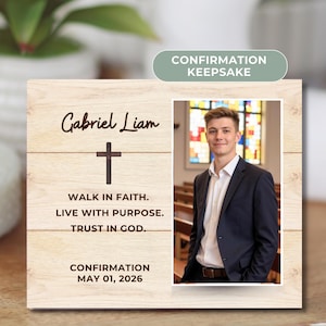 May include: A wooden Confirmation keepsake with a photo of a young man in a suit. The keepsake includes the name "Gabriel Liam", a cross, and the text "Walk in Faith. Live with Purpose. Trust in God." The date "May 01, 2026" is also included.