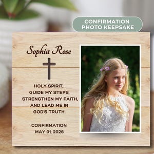 May include: A white ceramic mug with a black handle and the text "But First, Coffee" in a black, handwritten-style font. The mug is on a white surface.