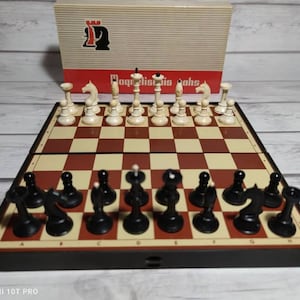 Latvian travel magnetic chess set with black chess board. In a good condition 80s vintage.  Great gift for mens.