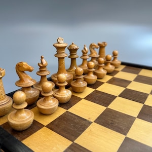 Germany Chess set 1800s vintage with original chess board in good condition. Chess pieces are beautiful. Interesting chess board. Roly-poly
