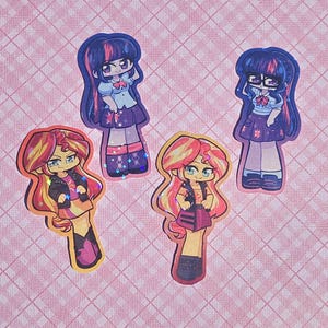 May include: Four colorful stickers featuring cartoon characters. Two stickers depict a character with purple hair and a school uniform. The other two stickers show a character with orange and yellow hair, wearing a black jacket and skirt.