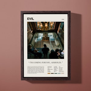 May include: A minimalist movie poster for the film "Evil" (2019). The poster features a black and white image of a group of people looking down from a balcony. The text "I'M COMING FOR YOU, ASSHOLES." is printed below the image. The poster is framed in a dark wood frame.