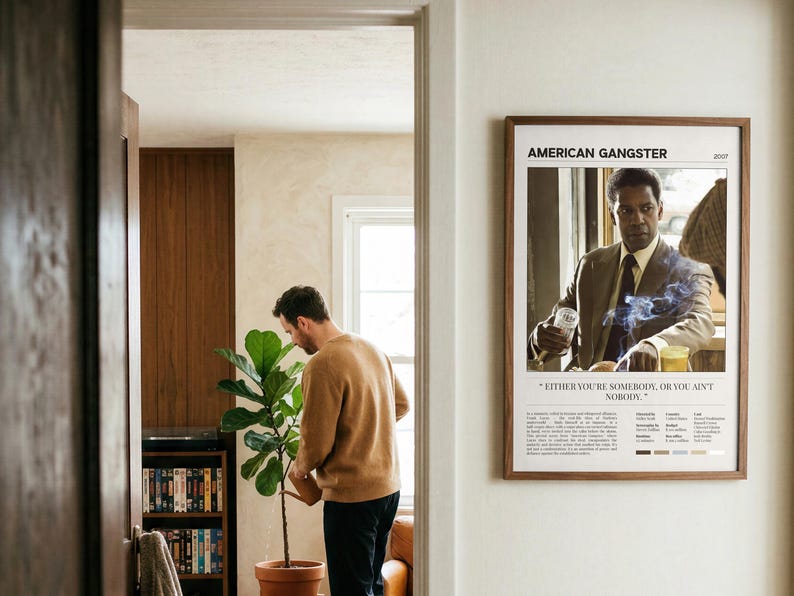American Gangster poster, Light edition, framed and seen through a doorway from the hall