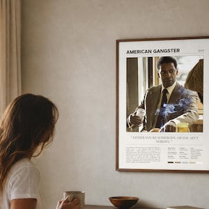 American Gangster poster, Light edition, framed and hung above a bed in a sunlit bedroom