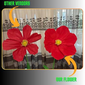 Peut inclure: Deux grandes fleurs de papier rouge vif avec des centres jaunes et des tiges vertes. Les fleurs sont pr&eacute;sent&eacute;es sur fond de rideaux &agrave; motifs. Le texte "OTHER VENDORS" et "OUR FLOWER" sont visibles.