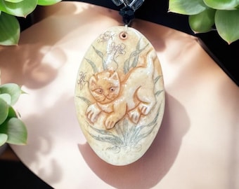 Artisan hand carved cat pendant beaded necklace.