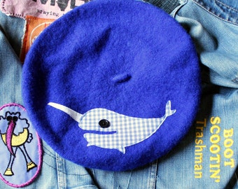 royal blue beret with applique narwhal