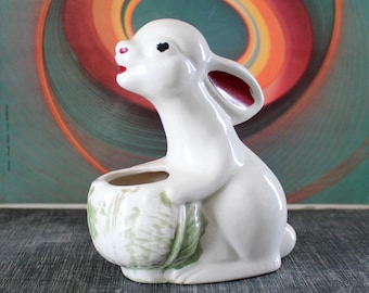 vintage UHL Pottery bunny rabbit planter or pencil holder, white with chippy paint crazy eyes, holding cabbage, 1940s home decor