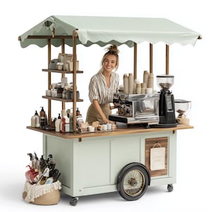 Può includere: Un carretto da caffè verde menta con una tenda da sole verde chiaro. Il carretto ha ripiani con vari prodotti, una macchina da caffè e un macinacaffè. Una donna sorride dietro il carretto. Un cesto intrecciato con prodotti è davanti al carretto.