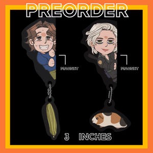 May include: Two cartoon character magnets, each with a chain and charm. One charm is a cucumber, the other a guinea pig. The magnets are 3 inches long and the word "PREORDER" is at the top.