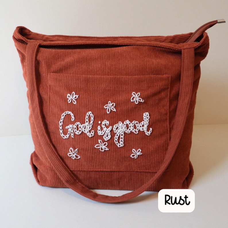 Rust corduroy Bible tote with zipper closure and front pocket, hand-embroidered with a faith-focused scripture design. Ideal for church, Bible study groups, school, or daily Christian use. Chic, handmade tote for women seeking functional, stylish, and meaningful Christian accessories and gifts. Handmade Corduroy Christian Tote Bag Zippered Bible Bag with Front Pocket Women’s Church Study Bag Faith-Inspired Gift Personalized Scripture Carry Bag.