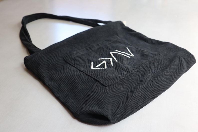 Unique handmade Christian corduroy tote bag embroidered with the phrase “God is Greater Than the Highs and Lows,” symbolizing strength and faith. Features a large outer pocket, zipper closure, and multi-pocket interior for organizing Bibles, journals, or personal items. Perfect for church, Bible study, or everyday wear. A meaningful Christian gift for women rooted in faith and perseverance. Baptism Gift Girl Sewn ToteBag For Car Travel Tote For Christian