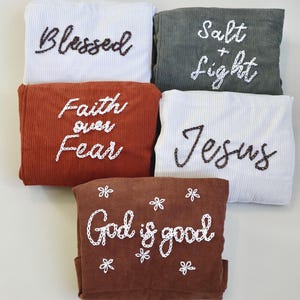 Inspirational embroidered tote bag crafted in soft, durable corduroy with “Salt + Light” stitched in artisan detail. Includes a large external pocket and several inner compartments, ideal for holding Bibles, journals, pens, and devotionals. Designed for Christian women who express their faith through style. Perfect for church, Bible study, or as a meaningful Christian gift that blends functionality and faith. Birthday Gift Ideas For Mom