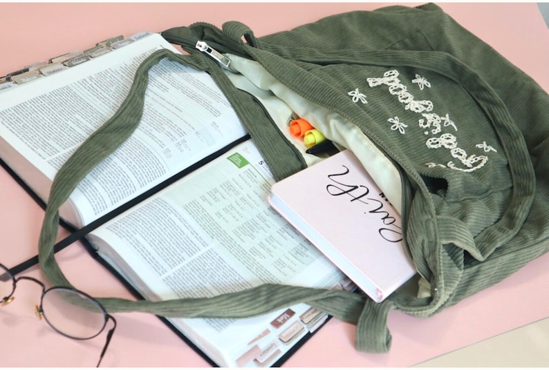 Stylish Christian corduroy tote bag with zipper and large front pocket, handmade with premium embroidered detailing that reads “Faith Over Fear.” Perfect as a women’s church bag, Bible study tote, or everyday Christian work bag. Designed for modern believers seeking functional, faith-based accessories that express style and devotion. Ideal faith gift for her, Christian birthday gift, or baptism present.