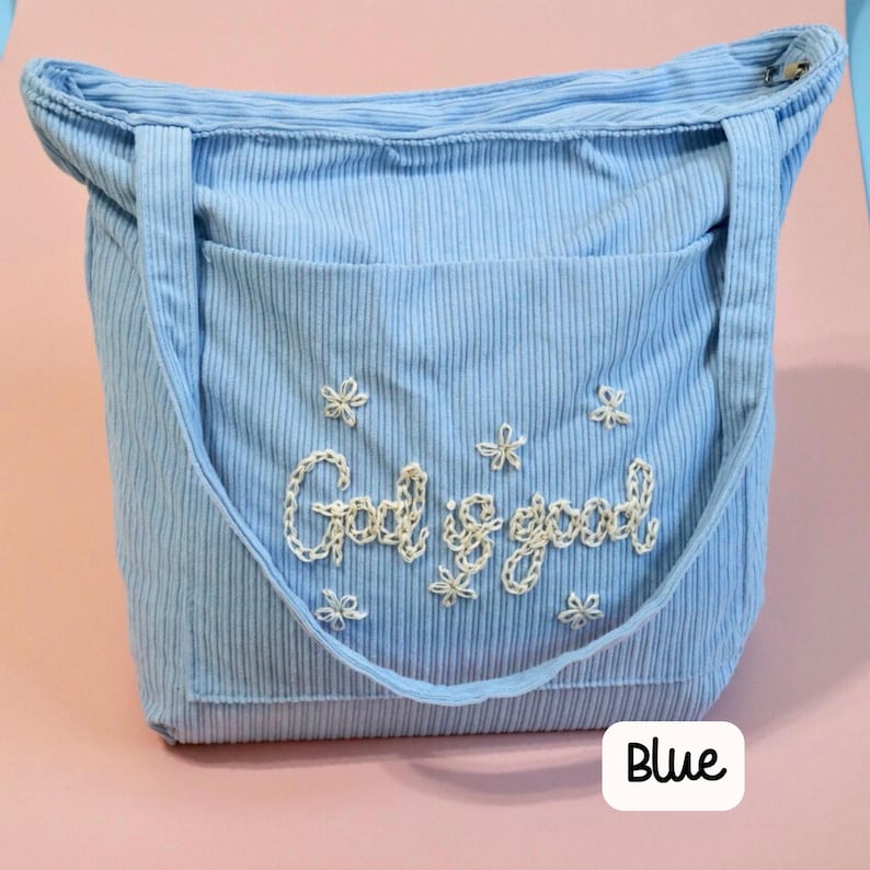 Blue corduroy church tote bag with zipper and large front pocket, hand-embroidered with scripture. Perfect for Bible study, Sunday school, or daily devotional use. Handmade Christian tote for women who want functional, stylish, and faith-driven accessories, ideal for gift or personal Bible carrying bag. Faith inspired tote bag with floral design. Christian gift idea for women, perfect for Mother's Day, Anniversary gift, wedding gift, birthday present and Christmas Gift idea for sister or friend.