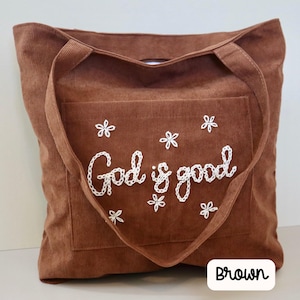 Handmade brown corduroy church tote bag with zipper closure and large front pocket. Embroidered scripture design perfect for Bible study, Sunday school, or daily Christian use. Stylish, durable, and functional tote for women seeking faith-inspired gifts, Bible carrying bag, or personalized Christian accessory for everyday inspiration. Chain Stitch Tote Bag custom embroidered to read God is Good.