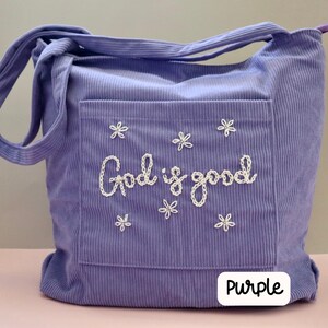 Handmade purple corduroy Bible tote with zipper closure and front pocket. Embroidered faith-inspired design perfect for church, Bible study, or everyday Christian use. Durable and stylish tote for women, ideal for gifting to Christian friends, carrying devotionals, or organizing Bible study essentials.