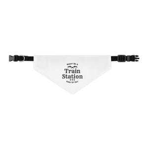May include: White pet bandana with black adjustable collar and buckle. The bandana has the text "MIGHT BE A Train Station KIND OF DAY" in black. The bandana is triangular in shape.