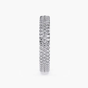 White gold eternity band with 3 rows of small diamonds around the band.