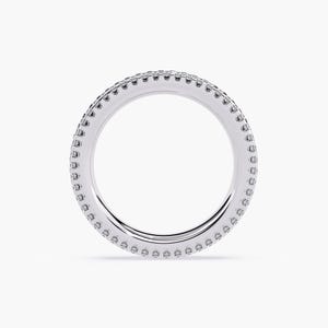 White gold eternity band with 3 rows of small diamonds around the band.