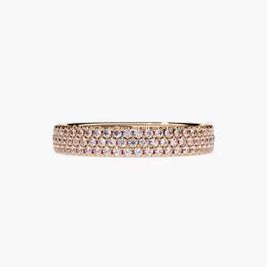Rose gold eternity band with 3 rows of small diamonds around the band.