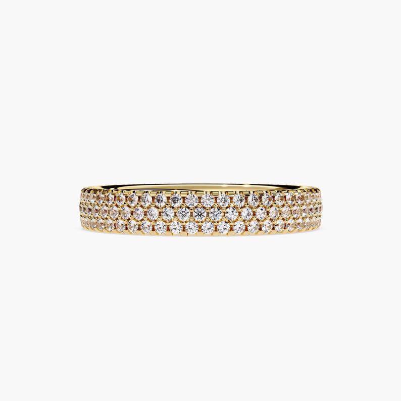 Yellow gold eternity band with 3 rows of small diamonds around the band.
