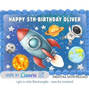 May include: A rectangular cake with blue frosting and a space-themed design. The cake features a rocket, planets, stars, and an astronaut. Text reads "HAPPY 5TH BIRTHDAY OLIVER." The cake measures 14 inches by 10 inches.