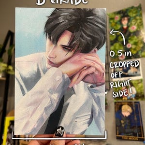 May include: A B-GRADE print of a portrait of a person wearing a white shirt and black tie. The print measures 12.7 cm by 17.8 cm. The text "B-GRADE" is at the top. The text "0.5 in. CROPPED OFF RIGHT SIDE!" is on the right side.