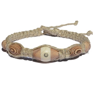 Natural thick wide twisted hemp necklace with Inlaid Wood and Carved Bone Tanzanian Bead in center with vintage Japanese wood beads around