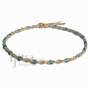 Natural twisted hemp necklace with small sky blue glass beads throughout