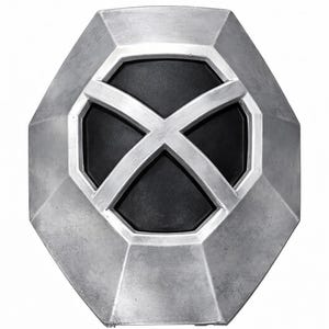 May include: A silver-colored, octagonal shield with a black center. A silver X-shaped design is centered on the black area. The shield has a metallic finish and a geometric design.