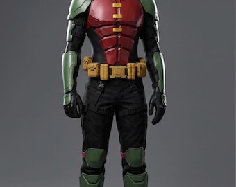May include: A full-body costume featuring a black base suit with red chest armor, green shoulder and leg guards, and a tan utility belt. The ensemble includes a black domino mask and black gloves. The text "COSPLAY CASSANOVA" appears at the bottom.