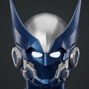 May include: A close-up of a futuristic helmet with a blue and silver color scheme. The helmet features prominent, angular blue accents, including two upward-pointing horns. The faceplate has glowing white eyes and metallic detailing.