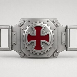 May include: A rectangular silver-toned metal belt buckle featuring a central gear design with a deep red cross emblem. The buckle has a brushed metallic finish, visible rivets, and two rectangular loops on the sides for attaching to a belt strap.