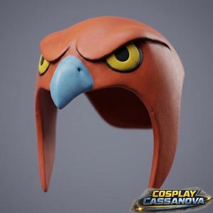 May include: A sculpted orange helmet shaped like a bird head with a prominent light blue beak and two yellow eyes with black pupils. The helmet features a smooth, matte finish and a stylized, angular design. The text COSPLAY CASSANOVA is visible.