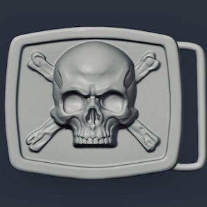 May include: A gray rectangular belt buckle featuring a skull with crossed bones. The skull has detailed eye sockets, a nose cavity, and teeth. The buckle has a rectangular frame and a metal loop for the belt.
