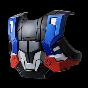 May include: A futuristic-looking chest plate in a bold color scheme of blue, red, black, gray, and white. The design features geometric shapes and angular lines, suggesting a high-tech or robotic theme. The plate has a textured surface and a symmetrical design.