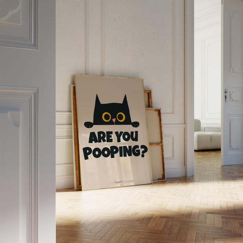 May include: A black cat with yellow eyes peeks over a white wall with the text "Are you pooping?" printed in black.