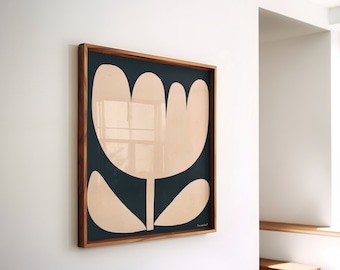 May include: A framed art print featuring a large, stylized flower in beige against a dark teal background. The artwork is encased in a natural wood frame and hangs on a white wall. The overall aesthetic is modern and minimalist.