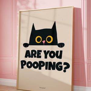 May include: A black cat with yellow eyes peeks over a beige background with the text "Are you pooping?" in black. The text "Tommenkat" is in smaller black text at the bottom of the image.