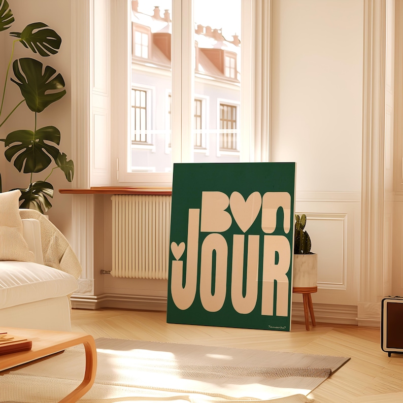 May include: A green and cream colored wall art print with the text "Bonjour" in a stylized font. The text is in a cream color and the background is a deep green.