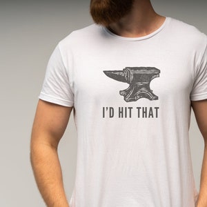 May include: A white t-shirt with a black and white illustration of an anvil and the text "I'd hit that".