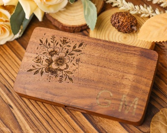 Personalized walnut business card holder with carved flower design and customized initials - an elegant office accessory for professionals