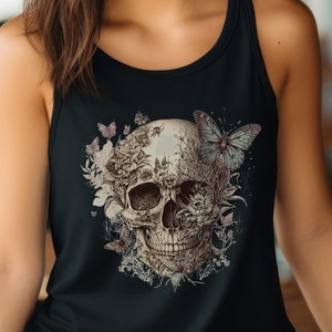May include: A black tank top with a floral skull design. The skull is surrounded by flowers and butterflies in shades of pink, blue, and green.