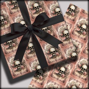May include: A gift wrapped in pink and white patterned wrapping paper with a black bow. The paper features a repeating pattern of skulls and flowers.