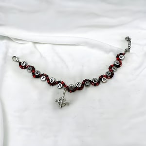 Frater Imperator Bracelet- wavy black and red bracelet with silver Grucifix charm