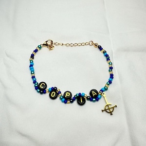 Copia Papa IV Wavy Bracelet - Teal, Blue, and Gold Beaded with Grucifix charm