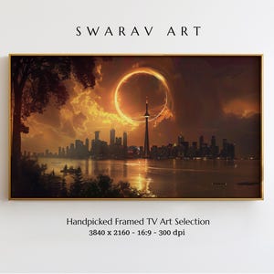 Può includere: Opera d'arte incorniciata raffigurante un paesaggio urbano sotto un cielo drammatico con un grande anello luminoso. L'opera, etichettata come "SWARAV ART", include il testo "Handpicked Framed TV Art Selection". La cornice è dorata.