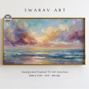 May include: A framed landscape painting with a golden border. The artwork depicts a seascape with a vibrant sky of blues, purples, and oranges. The painting is labeled "SWARAV ART" and "Handpicked Framed TV Art Selection".
